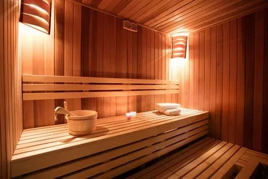 Experience Ultimate Relaxation with Indoor Saunas Luxurious indoor sauna with warm wood tones and ambient lighting